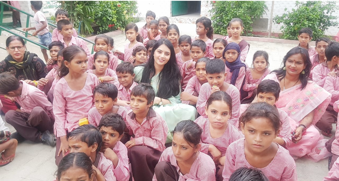 Sumedha Iyer with students at a school visit