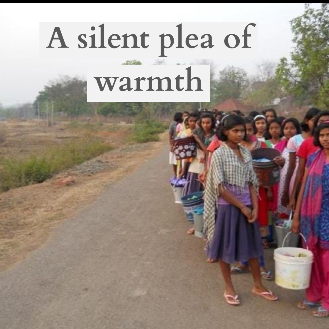 Girls carrying water — a silent plea of warmth