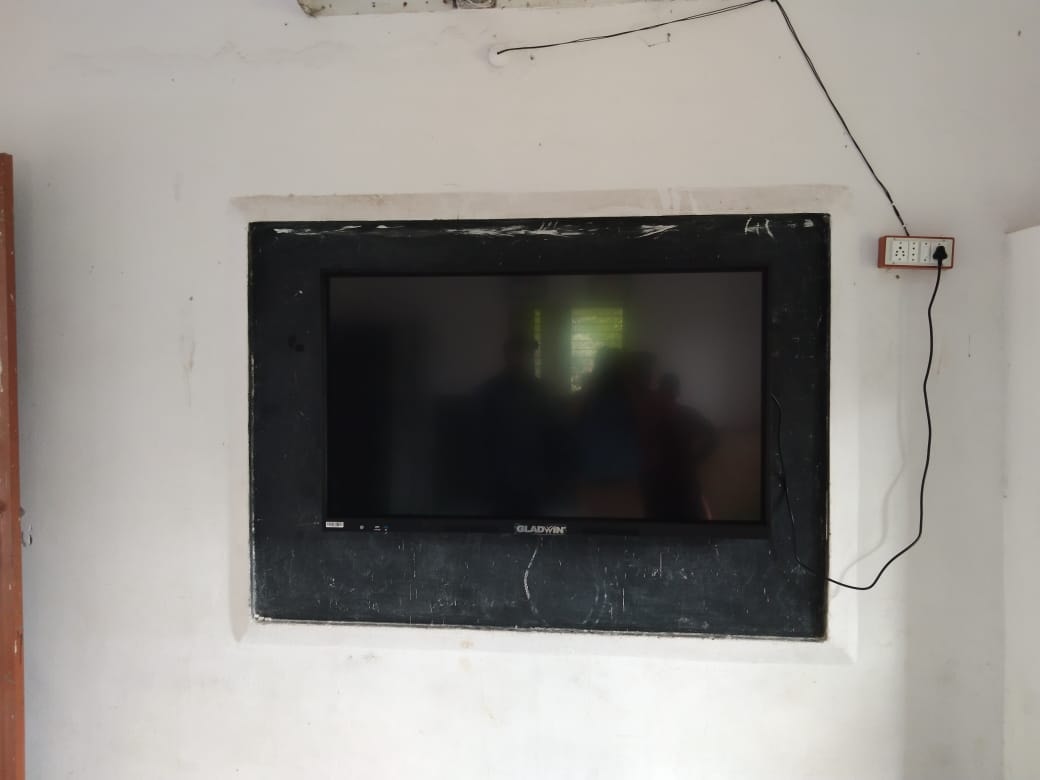 Gladwin smart board installed on a classroom wall at a village school